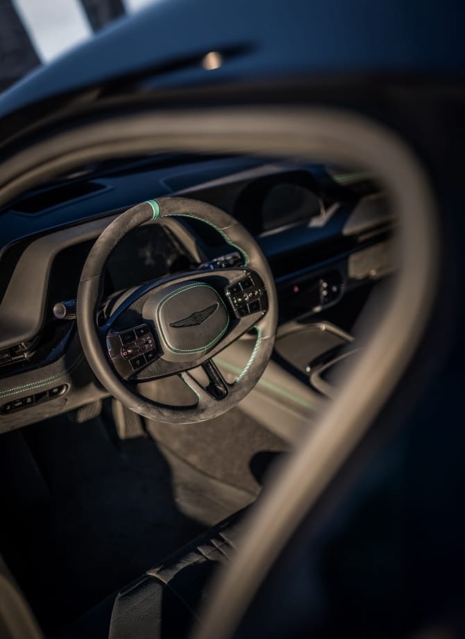 Interior details of the G90 Wingback, showing the steering wheel, dashboard, and center console.