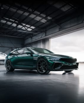 A light aircraft is parked at the rear of the hangar, while a G90 Wingback is parked in the center, shown from a direct side view.