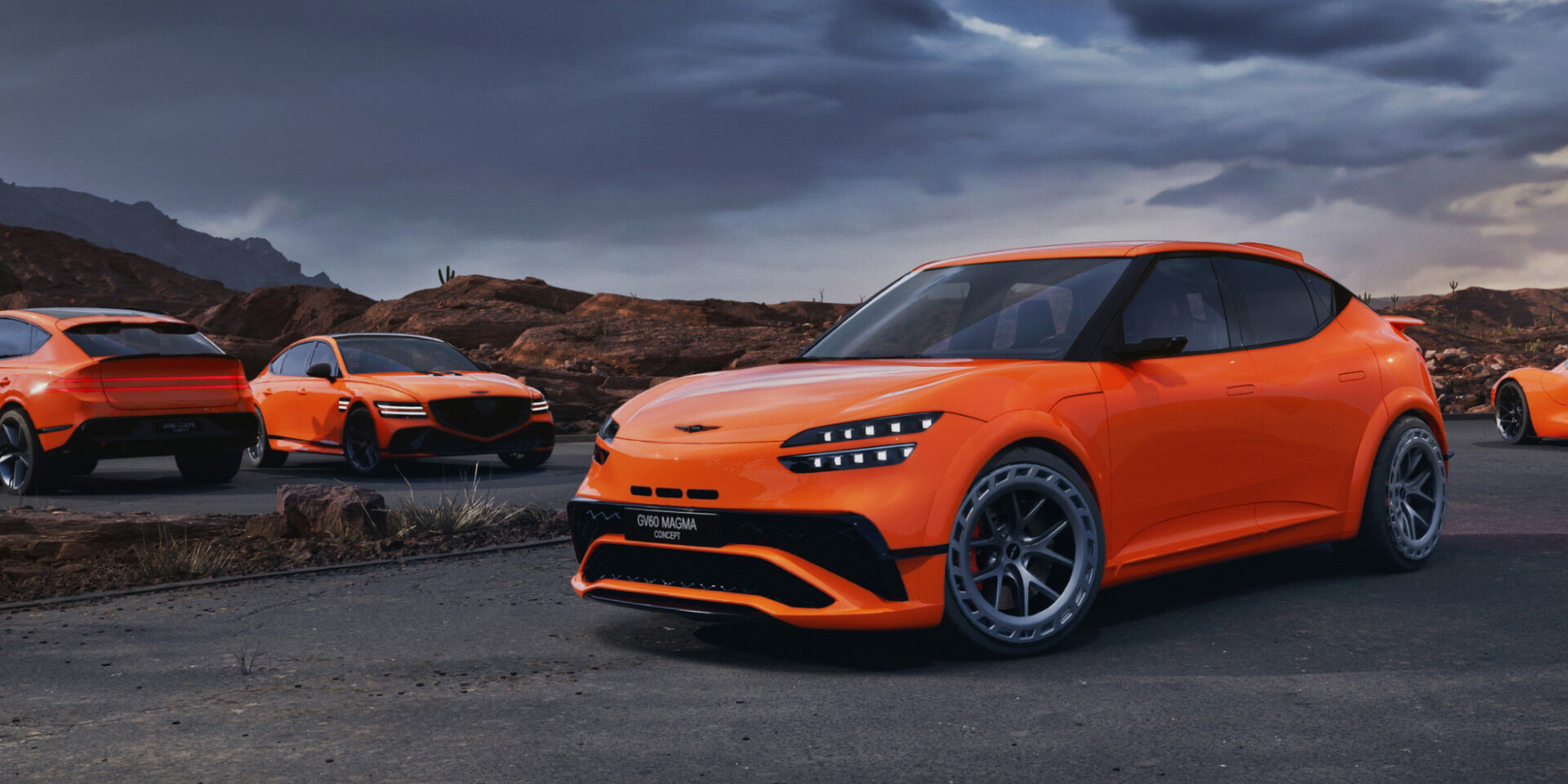 The GV60 Magma Concept, in a bold red-orange color, is parked diagonally in a dim outdoor setting with its front lights brightly on.