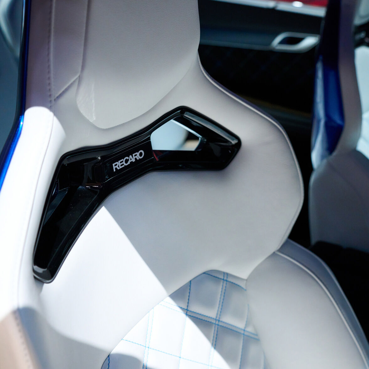 Vision blue two-tone Genesis G80 EV Magma Concept's interior can be seen, with interiors featuring white and blue two-tone colors.