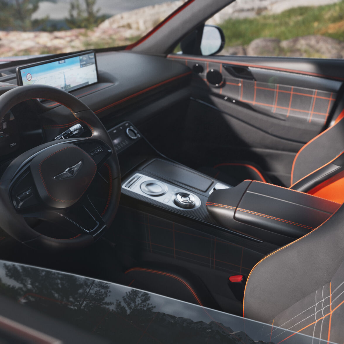 This is the interior of the GV80 Coupe Concept, viewed from the driver's side window. The steering wheel, display, and passenger seat are visible. The seats feature eye-catching stitch patterns in magma-inspired orange and light gray tones.