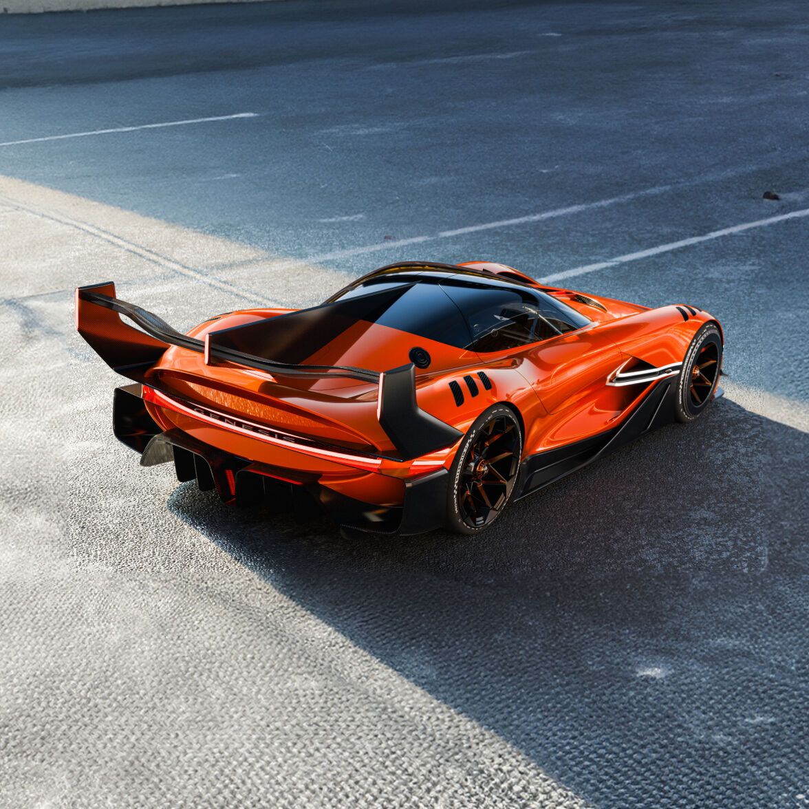 A magma orange colored Genesis X Gran Racer Concept's rear quarterview can be seen.