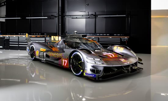 GMR-001 hypercar parked in a garage, front three-quarter view