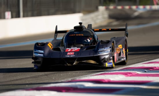 GMR-001 hypercar driving slowly on a circuit