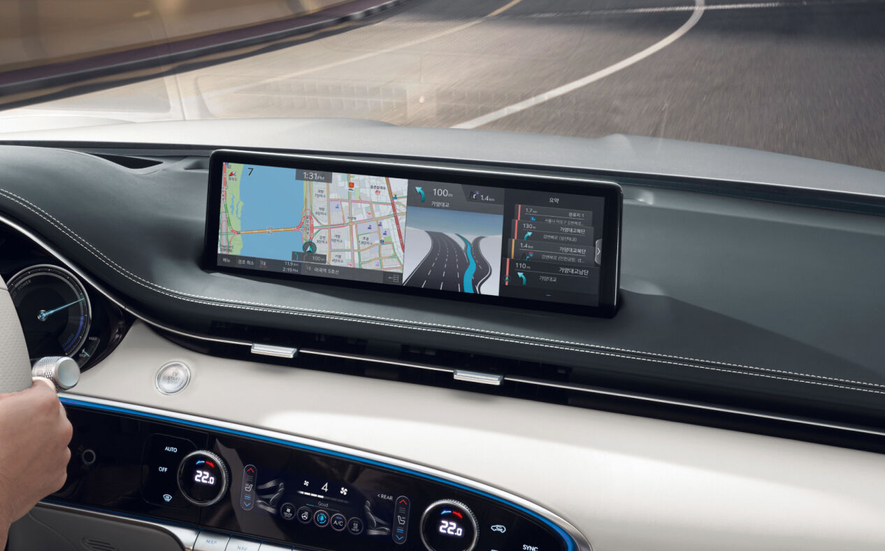 The Highway Driving Assist on the infotainment display is seen from a passenger’s POV.