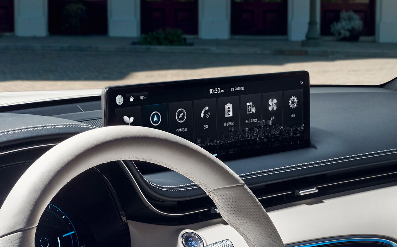 The 14.5-Inch Genesis Infotainment is seen close up from inside the car.