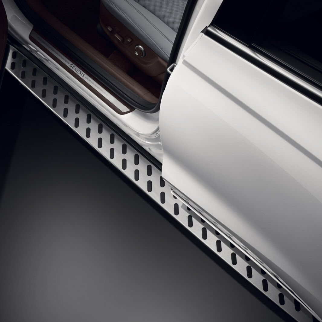 The open car door reveals detailed view of the slip-resistant pattern on the footstep, which assists with vehicle entry.