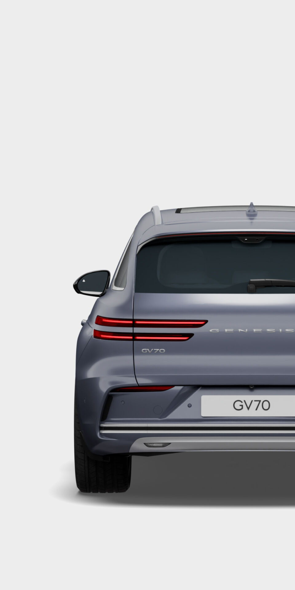 The rear view of the Electrified GV70 in Ceres blue exterior color is visible.