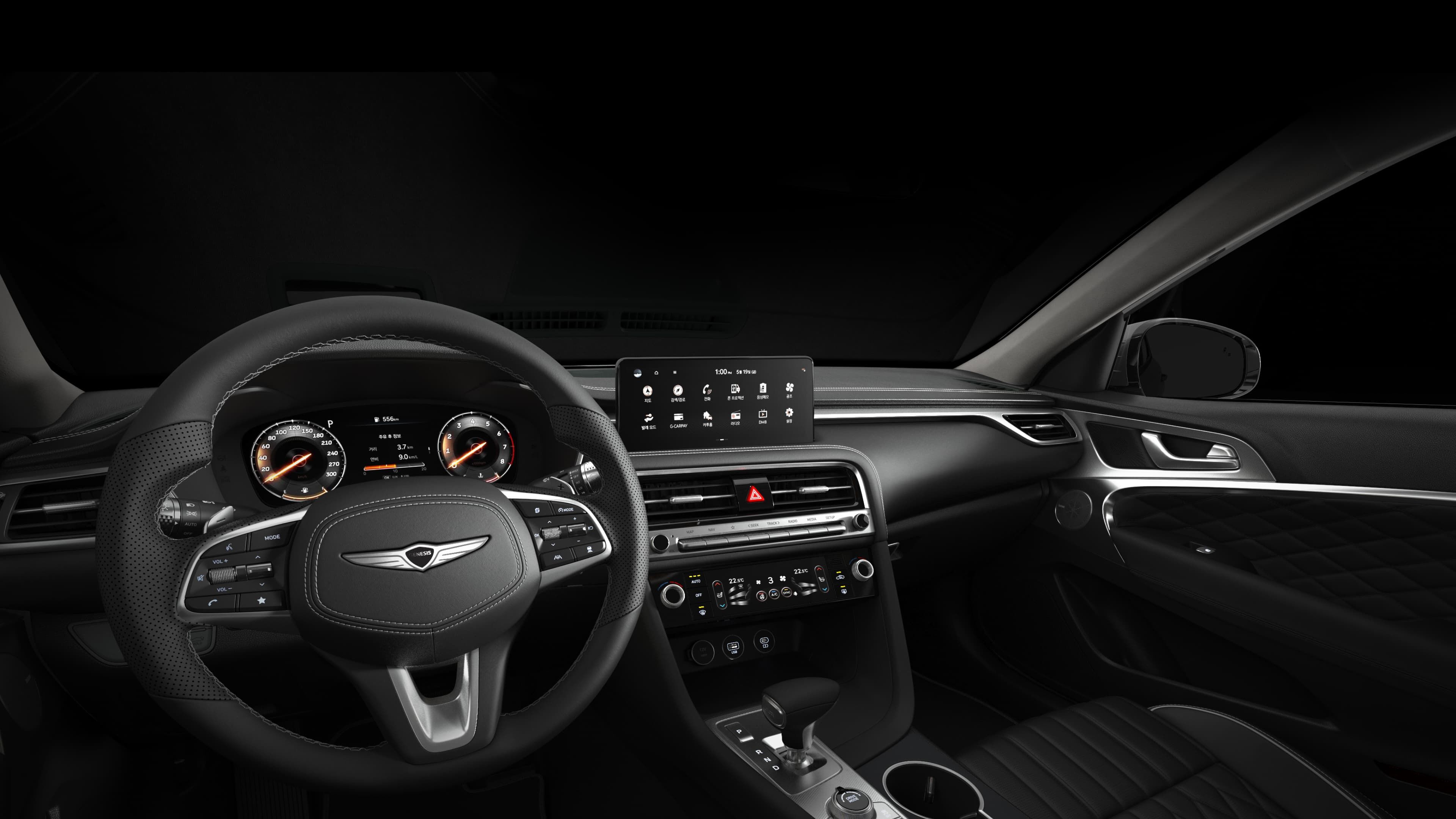 The interior of the G70 Shooting Brake, including the infotainment system, cluster, and air conditioning panel.