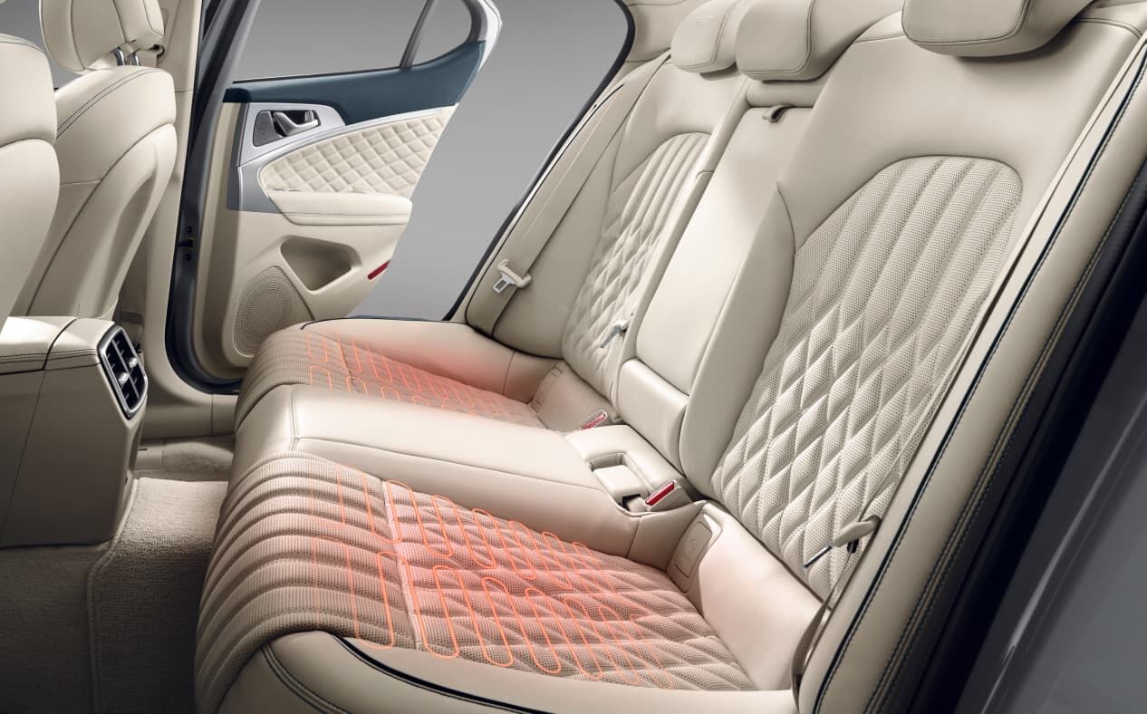 Heating rays are visible through the second-row seats of the Forest Bue/Vanilla Beige Two-tone interior.