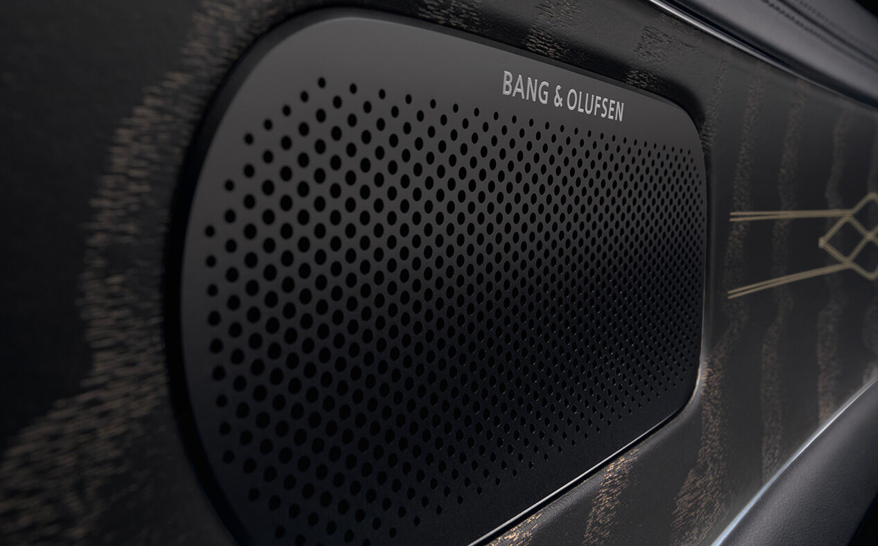 The side view of high-resolution sound speakers inside G90 Black's interior are displayed. The logo of BANG&OLUFSEN is written on the top of the speakers.