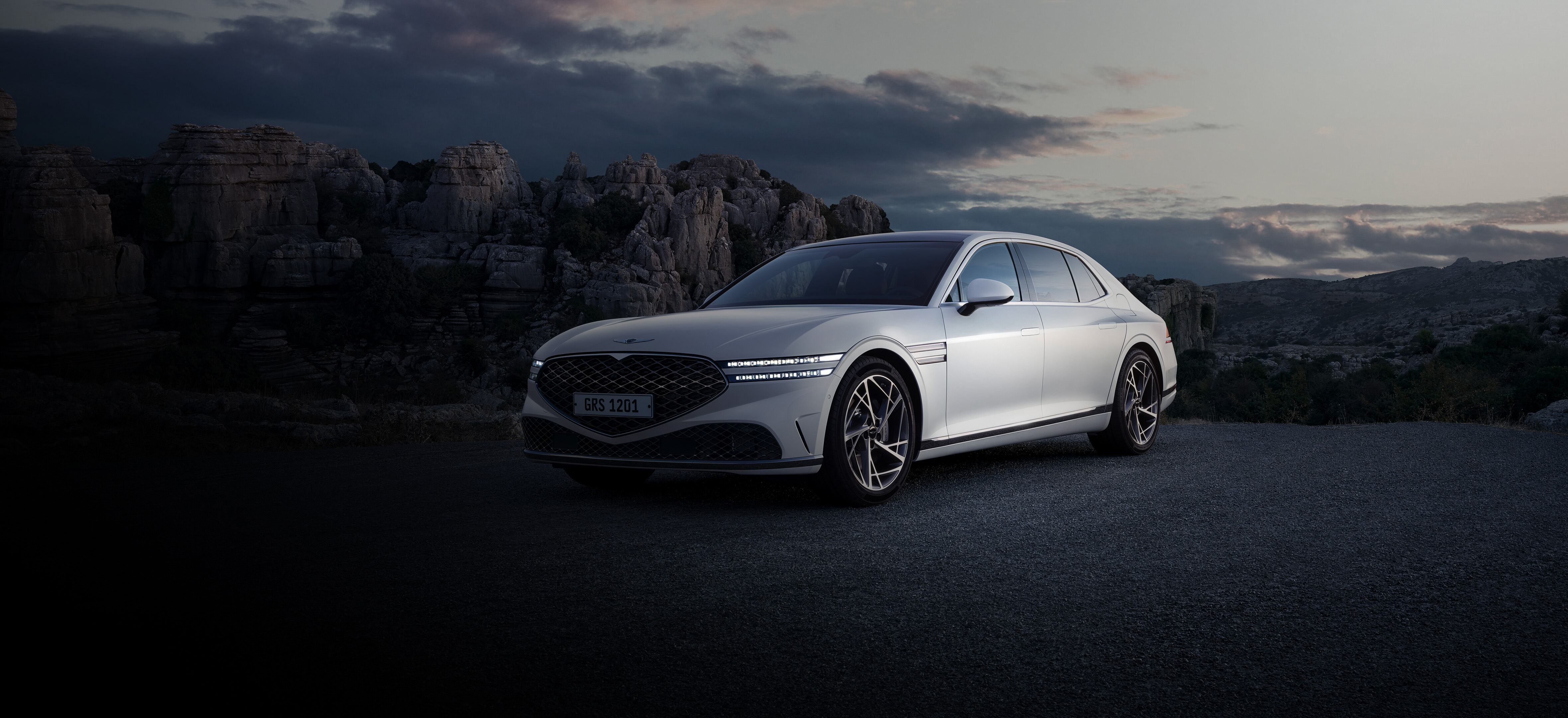 Front end of Verbier White G90 seen overlooking a cliff.