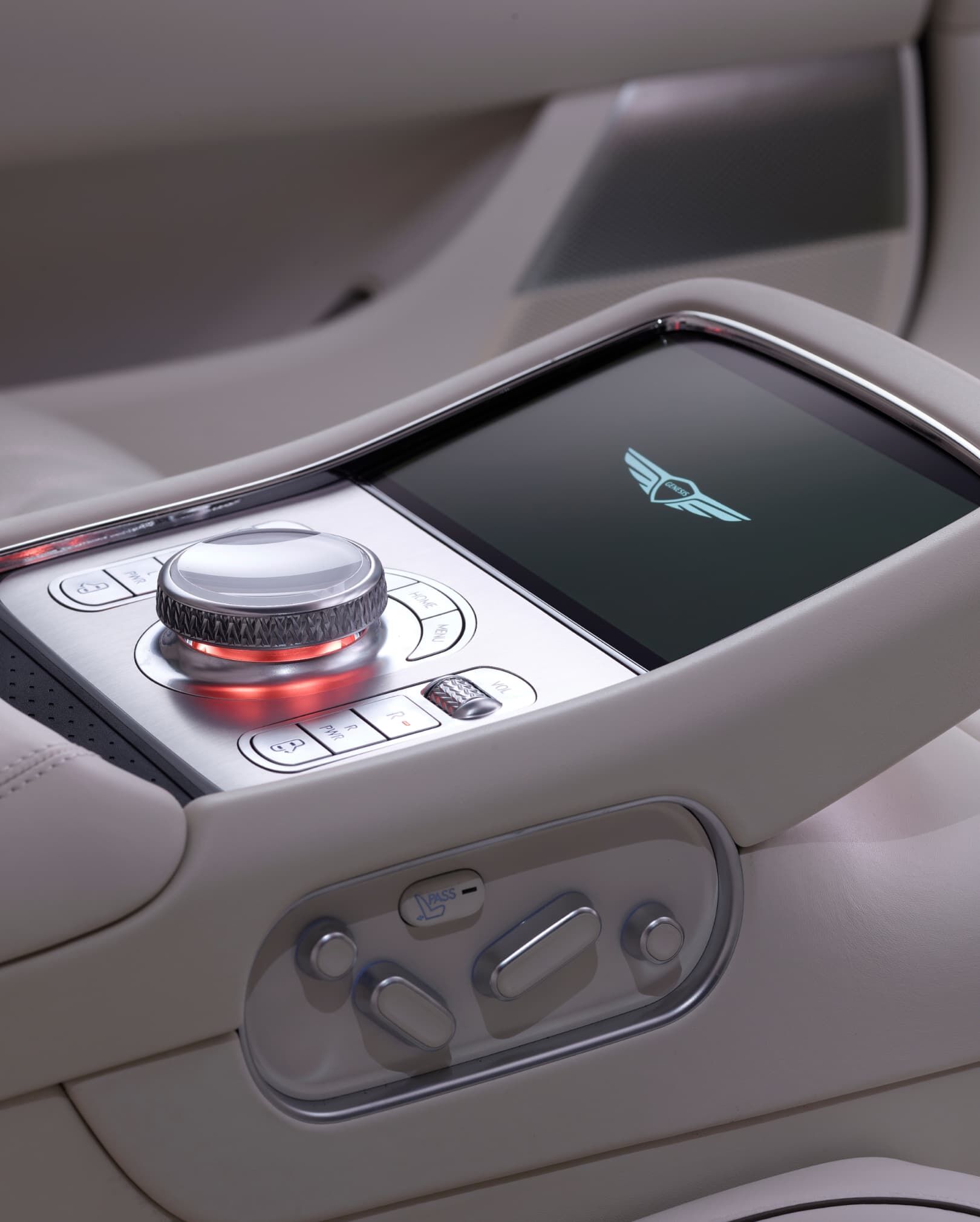 Second-row display and controller seen above Glacier White seats.
