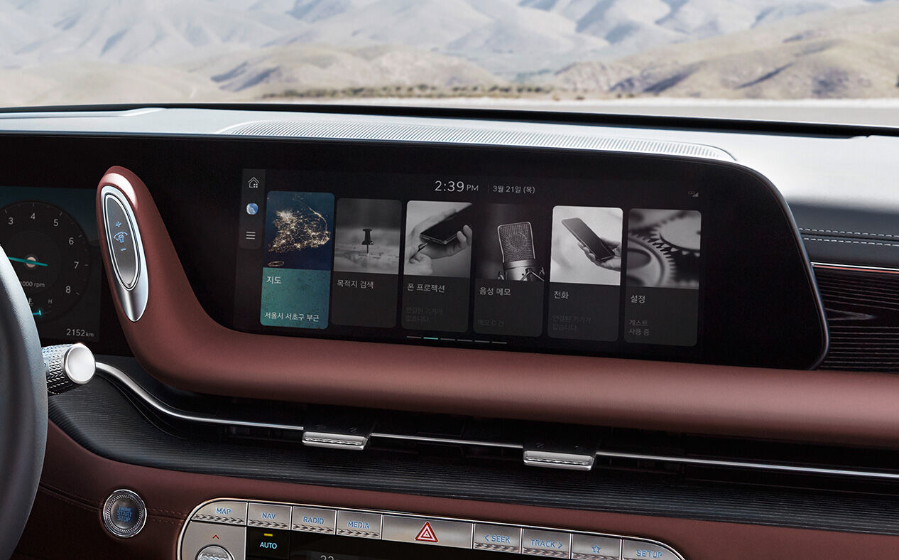 The infotainment display is seen with Bordeaux Brown seats. 