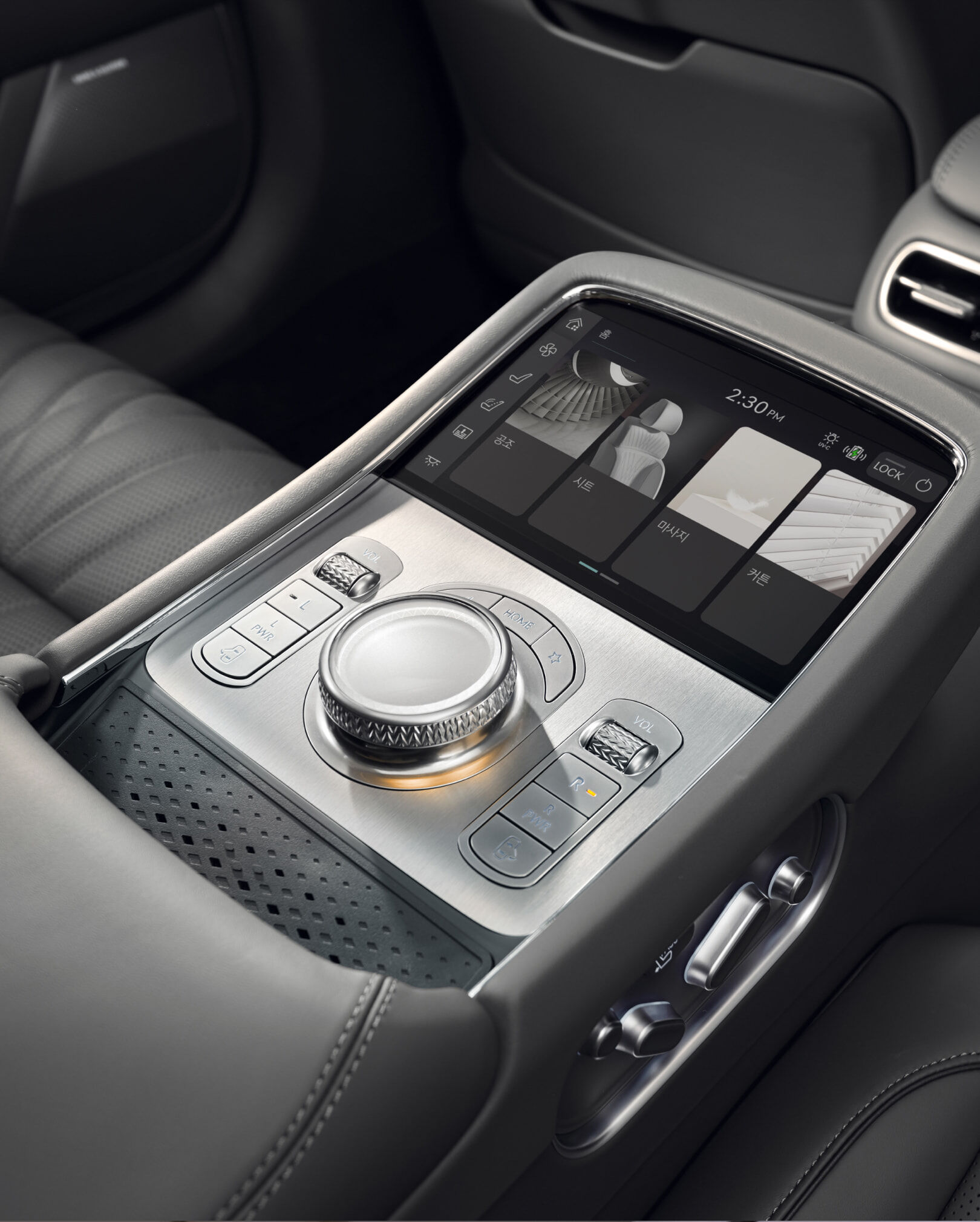 Second-row display and controller seen above Glacier White seats.