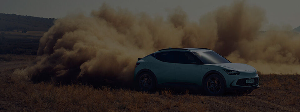 he Hanauma mint-colored GV60 is driving dynamically with a sandstorm.