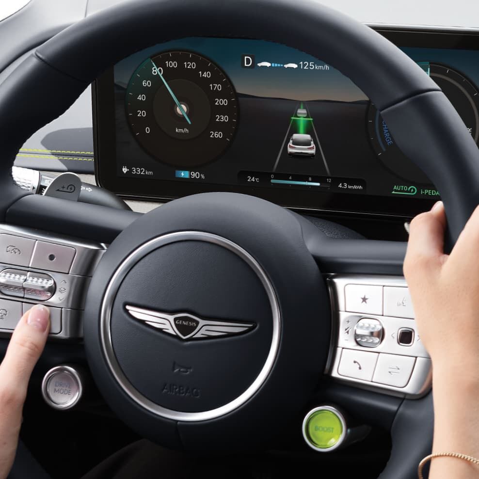 The paddle shifter on the left side of the steering wheel is visible with AUTO text on the cluster.