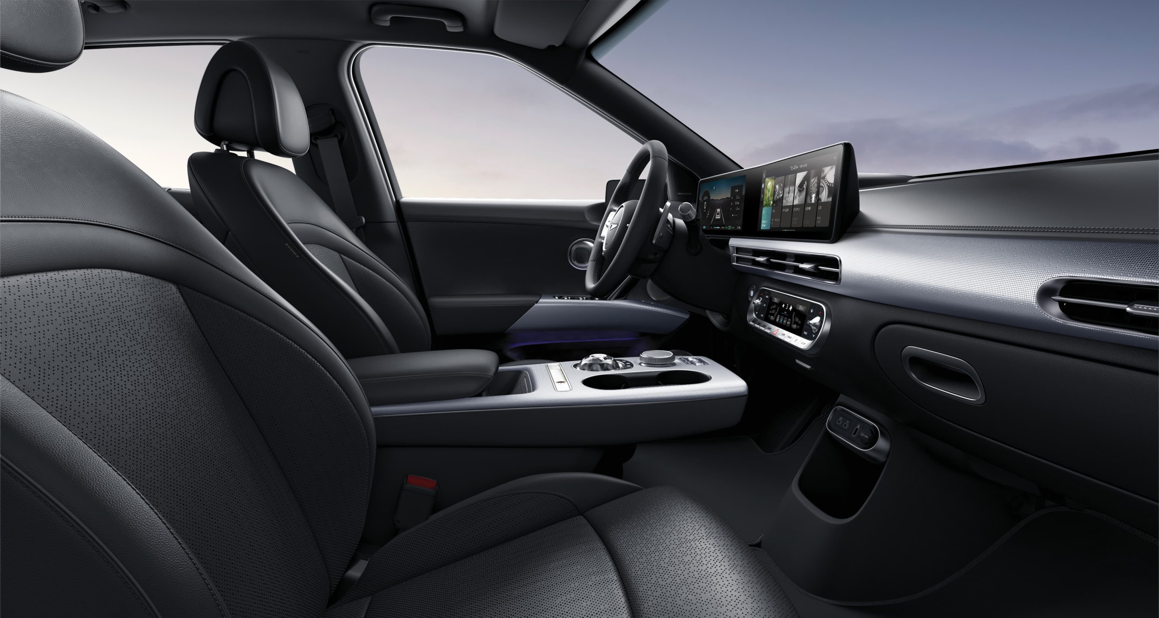 Looking at the driver's seat from the side of the passenger seat, GV60's interior in Obsidian Black Mono-tone.