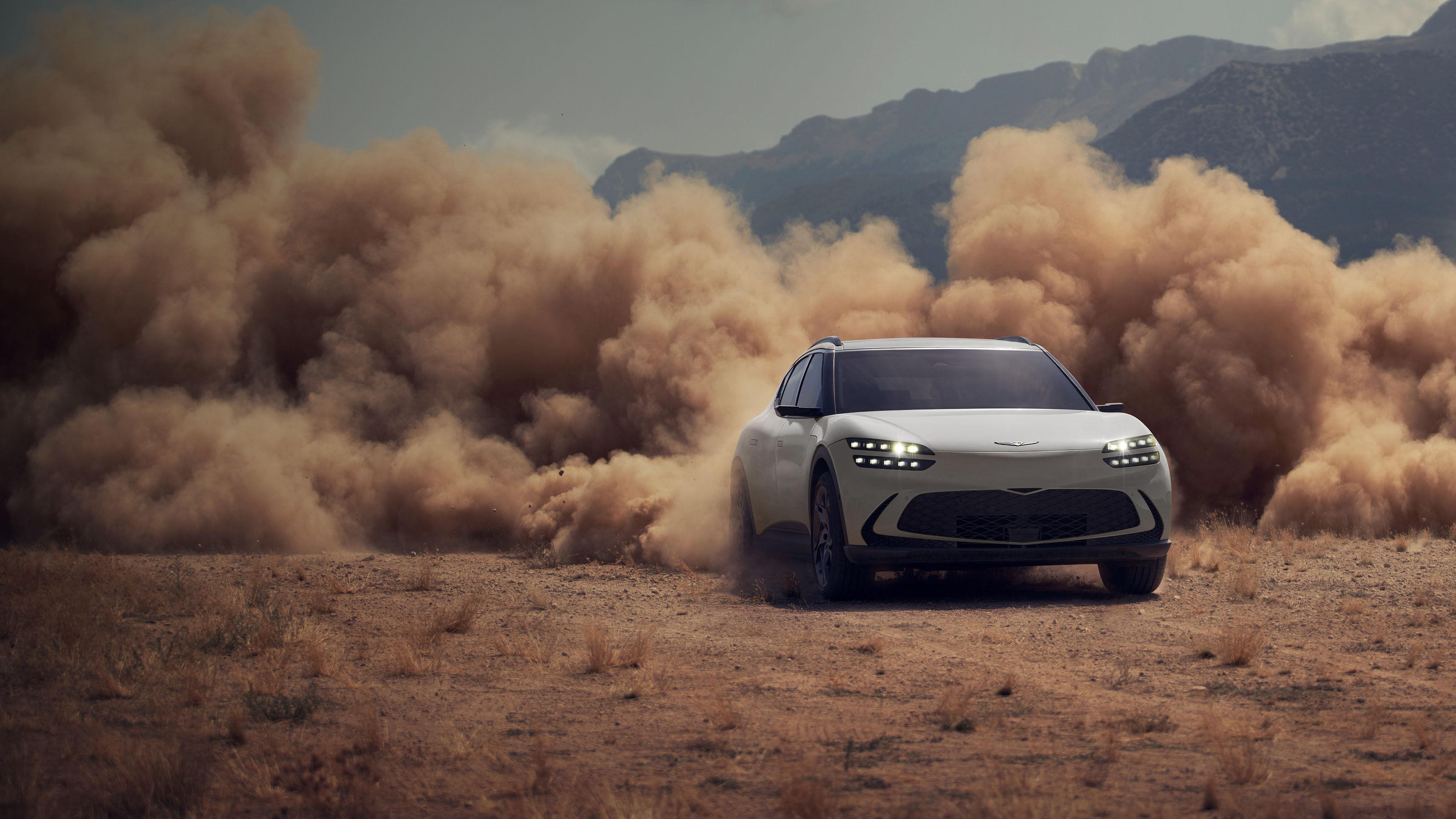 Hanauma Mint GV60 is seen driving on a sandy beach.