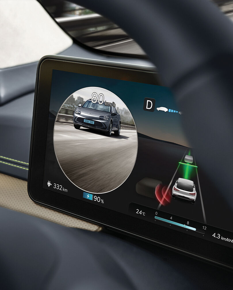 A vehicle is seen driving behind on the Blind Spot View Monitor.