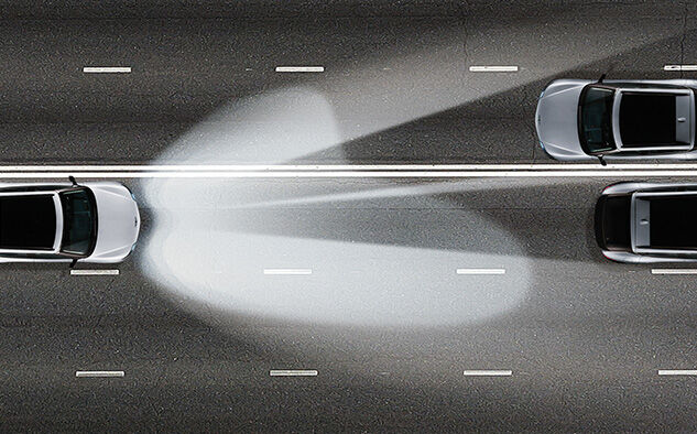 GV60 is seen driving on a dark road with the intelligent front lighting system turned on.
