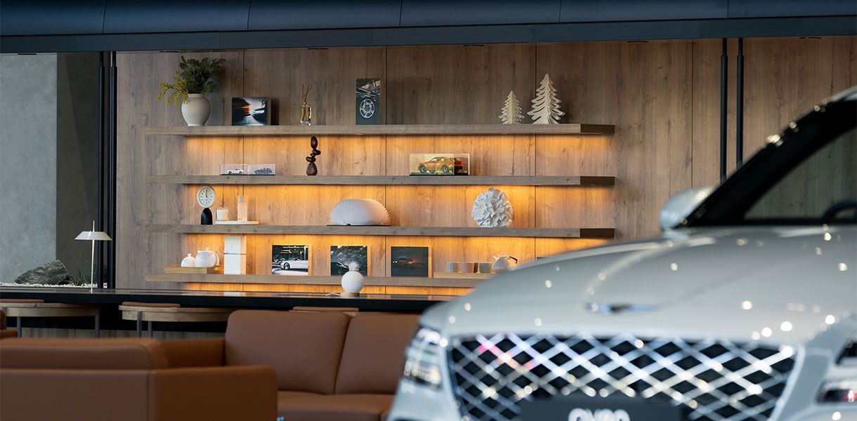 Genesis GV70 vehicles displayed inside a modern luxury showroom, showcasing refined design, premium craftsmanship and the Genesis retail experience. 