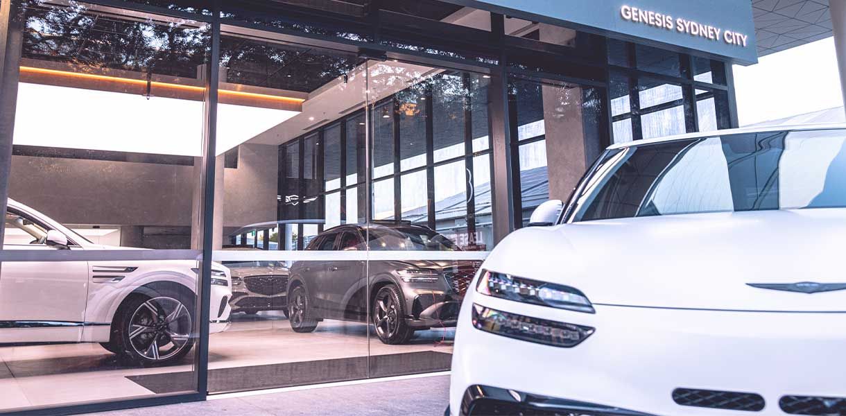 Explore Genesis Sydney City, featuring premium Genesis vehicles showcased in a contemporary luxury showroom environment.