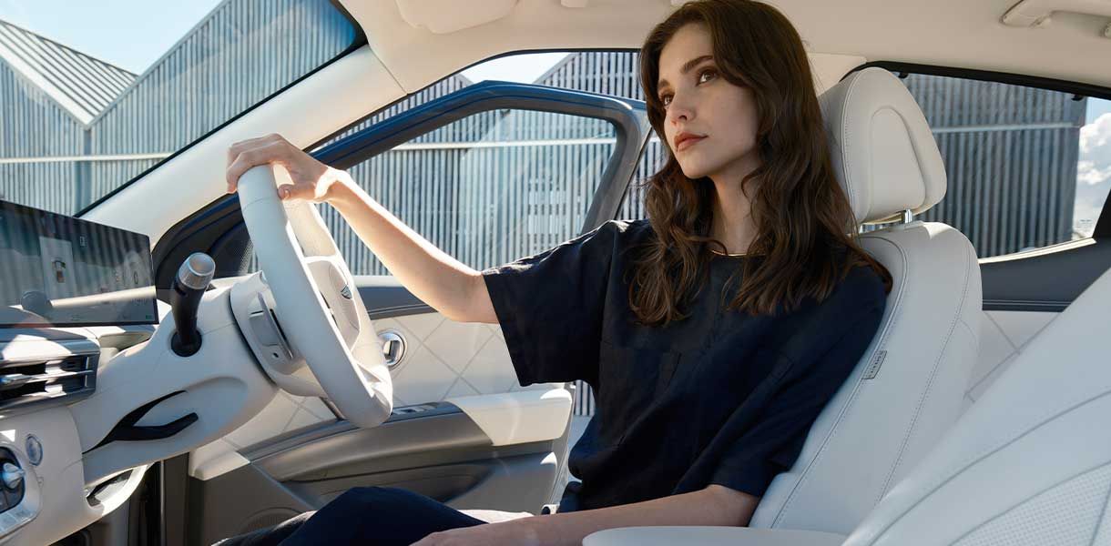 Premium Genesis GV60 interior showcasing a minimalist cabin design, advanced digital displays, luxury seating, and innovative electric vehicle technology.