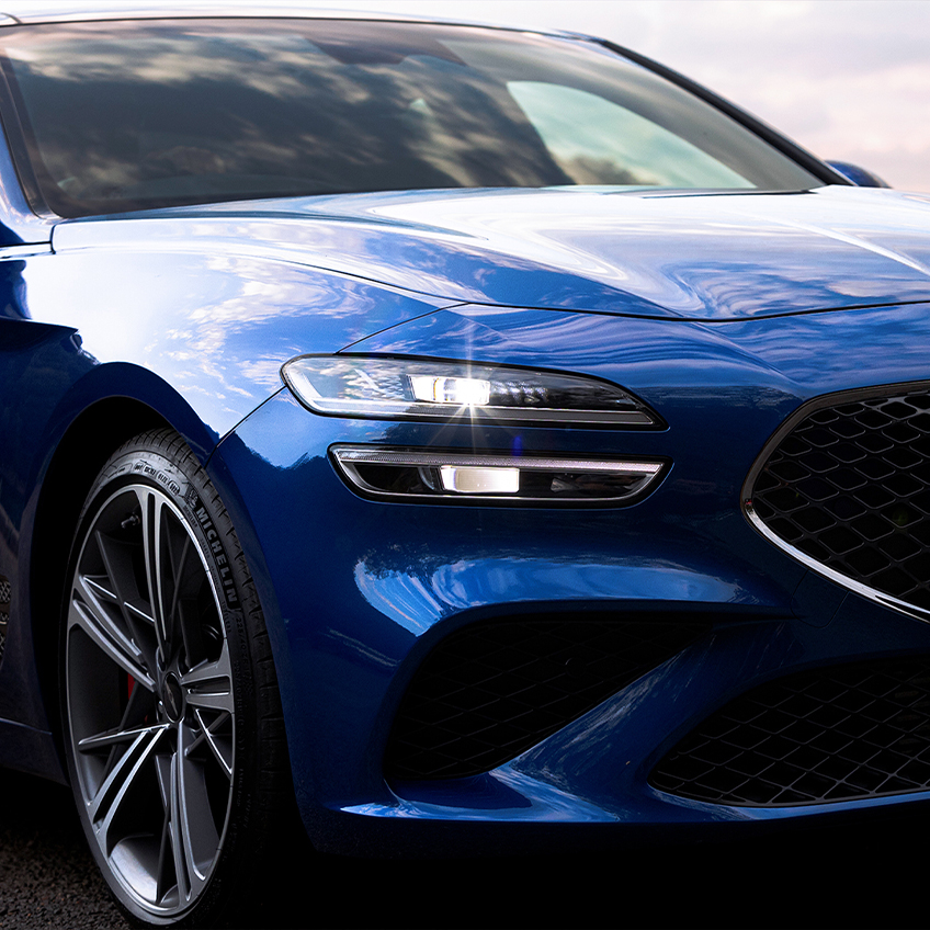 closeup of the headlight of a genesis g70 