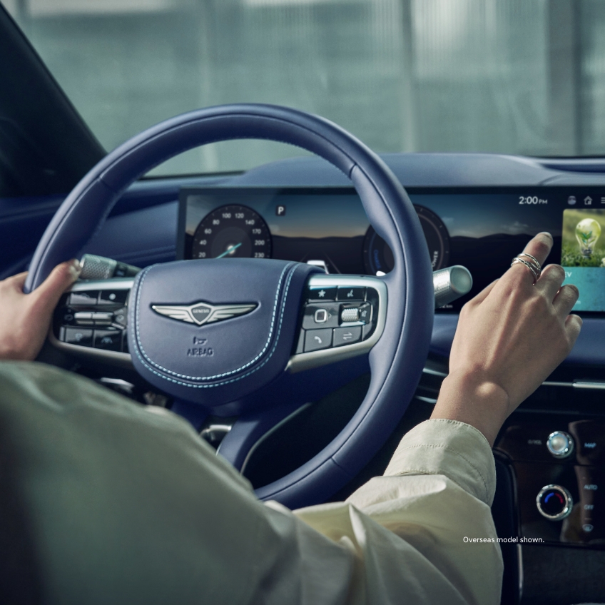 A side profile of the passenger seats of a Genesis G80 providing an insight into the amazingly fresh car experience.