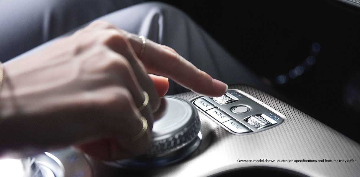 Close-up of the Genesis GV60 fingerprint authentication system on the centre console, allowing biometric vehicle access and personalised driver profile activation.