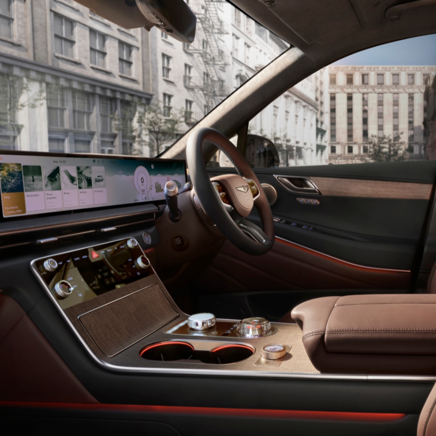 close up of gv80 sunroof, showing interior furnishing of the car roof and the dark grey leather seats
