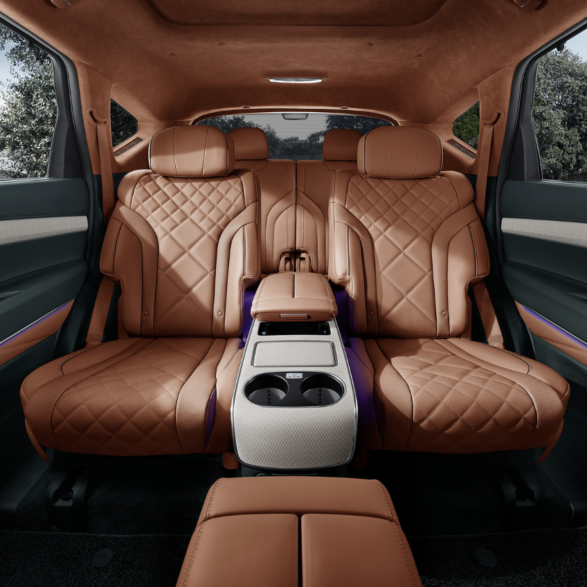 close up shot of front passenger seat dashboard and door, furnished with dark chocolate brown leather interior 