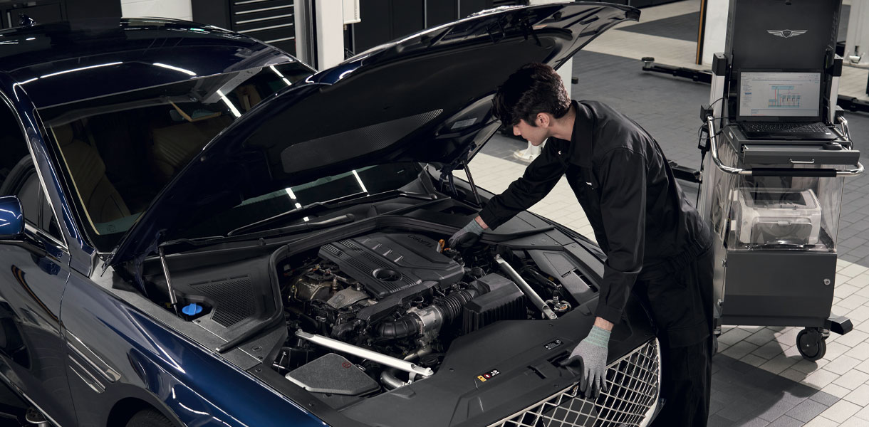Machanic working on Genesis car