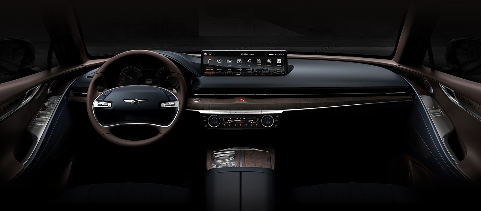 A spacious and calm car interior with luxurious black and brown leather and an oblong digital display in the centre