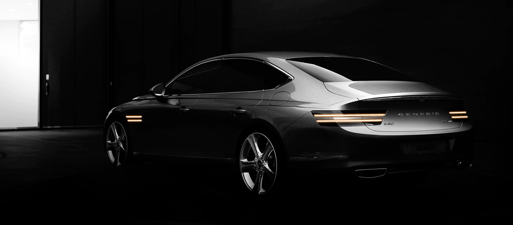 An impressive executive saloon is lit from above to highlight how the bodywork elegantly arcs from front to rear