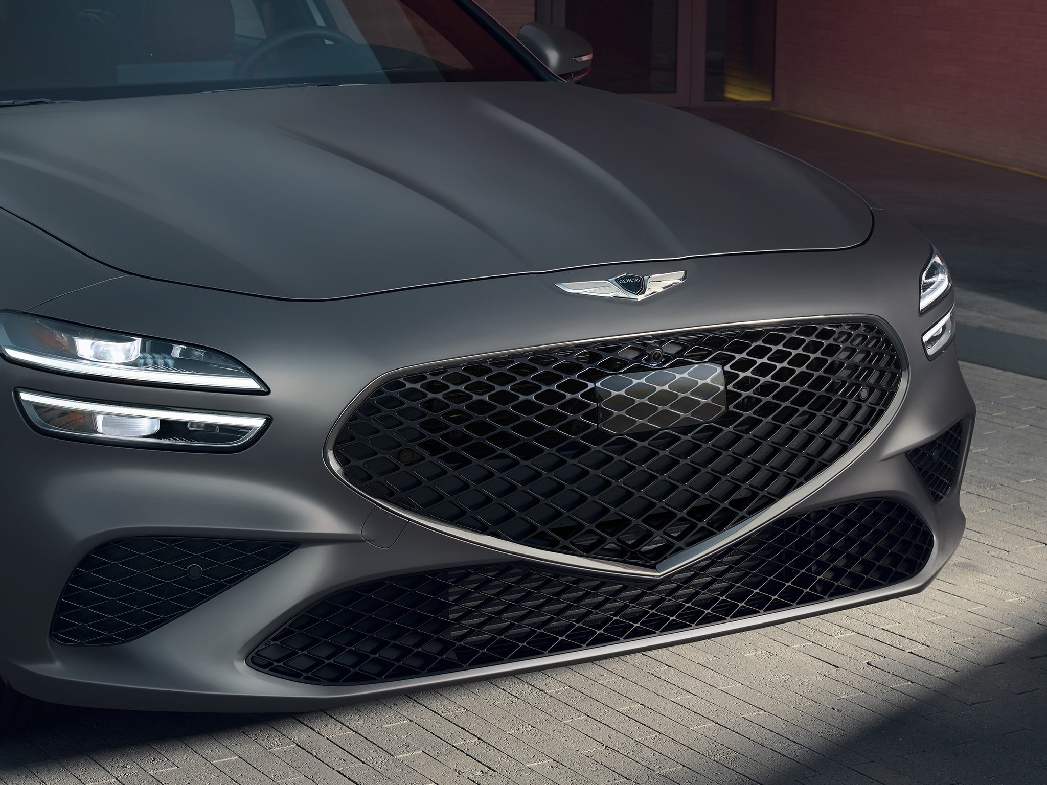 2022 Genesis G70 with crest grille and highway driving assist radar.