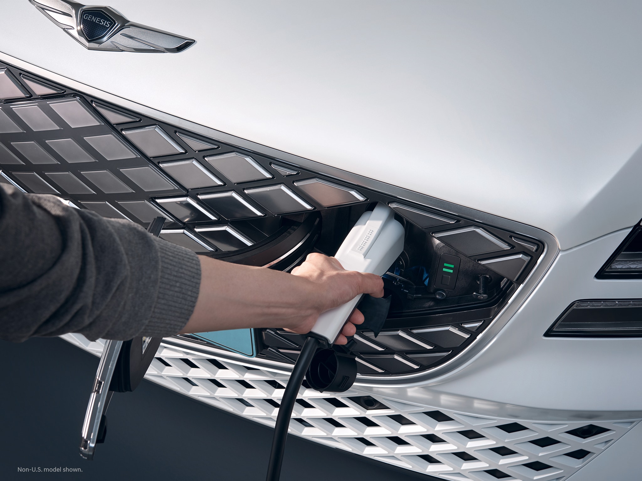 2023 Electrified G80 exterior shown in Uyuni White charging