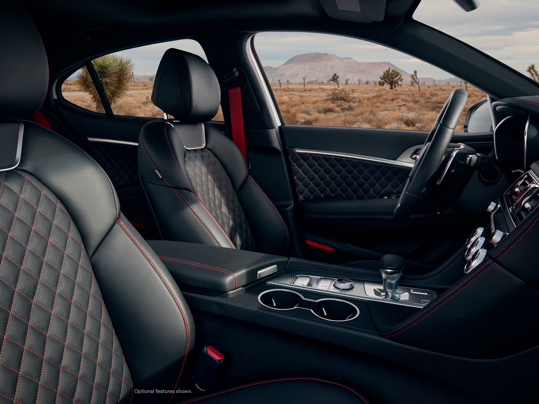 Center - 2023 Genesis G70 interior with quilted leather seats.