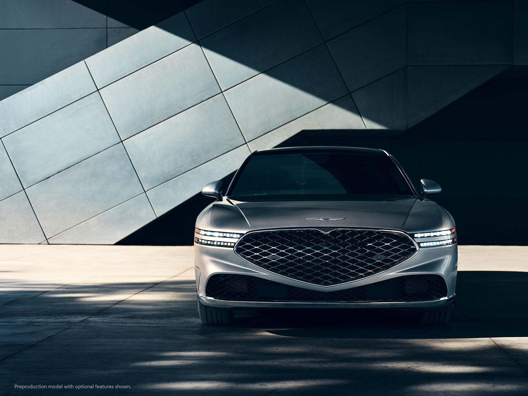 2023 Genesis G90 with Two Lines headlamps illuminated.