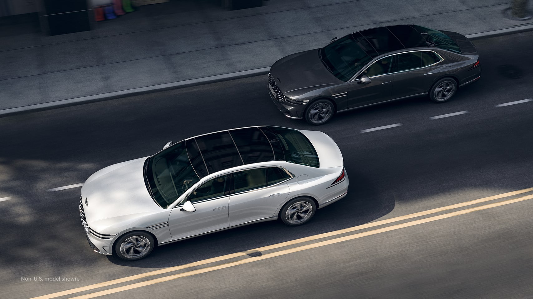 2023 Genesis G90 shown on road with vehicle in blind-spot.