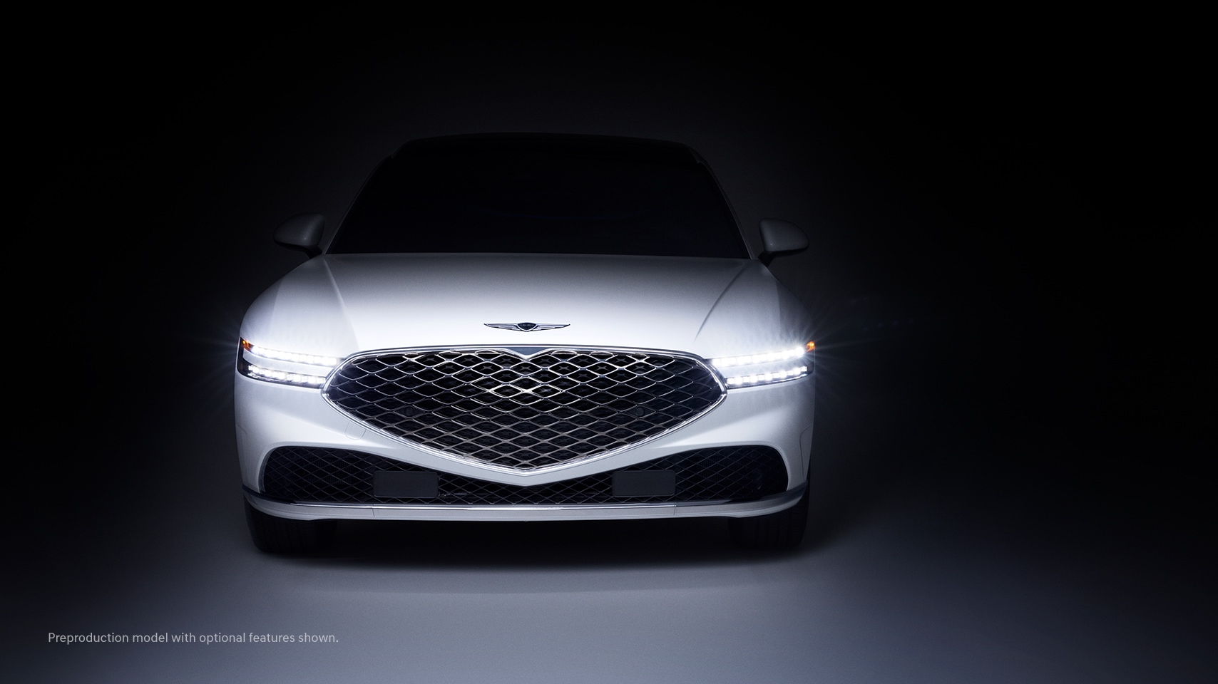 2023 Genesis G90 with Two-Line Headlamps illuminated.