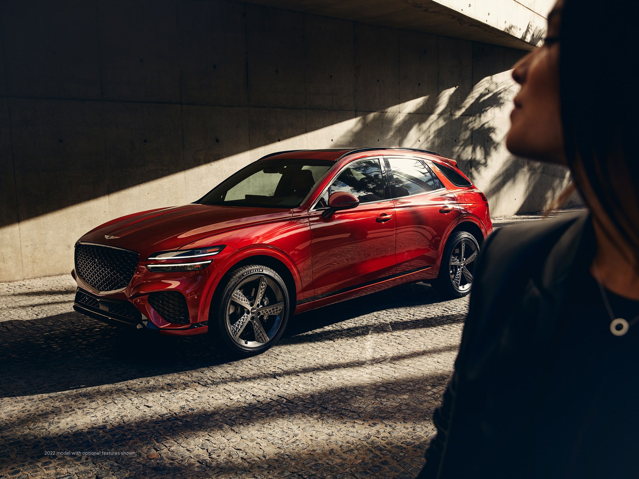 2022 Genesis GV70 shown in Mauna Red.