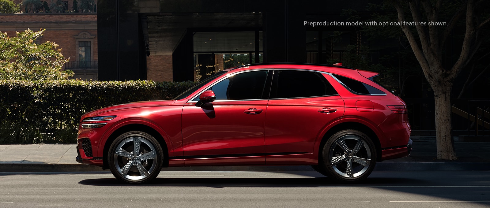 2023 Genesis GV70 shown in Mauna Red.