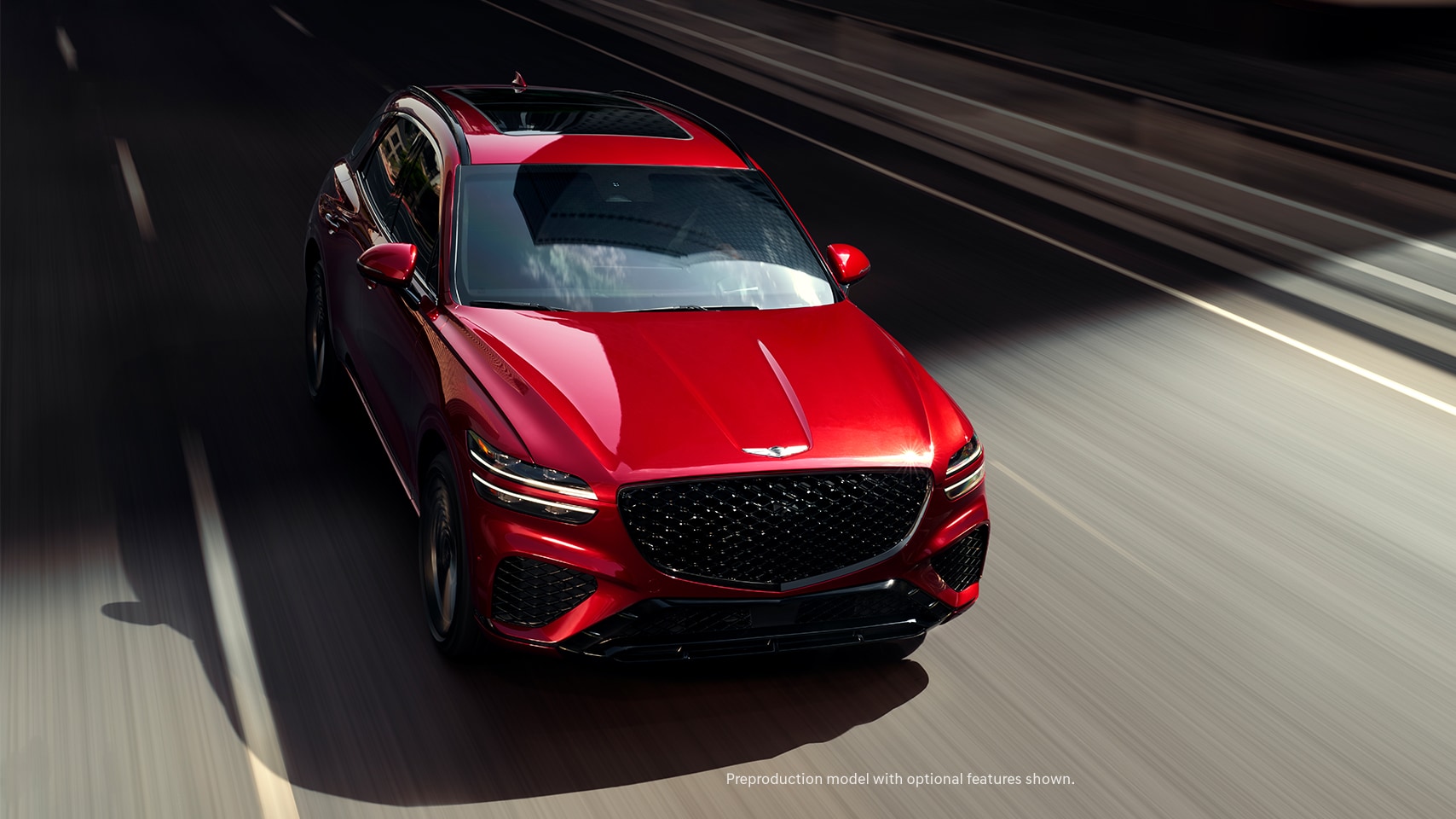 2023 Genesis GV70 shown in Mauna Red.