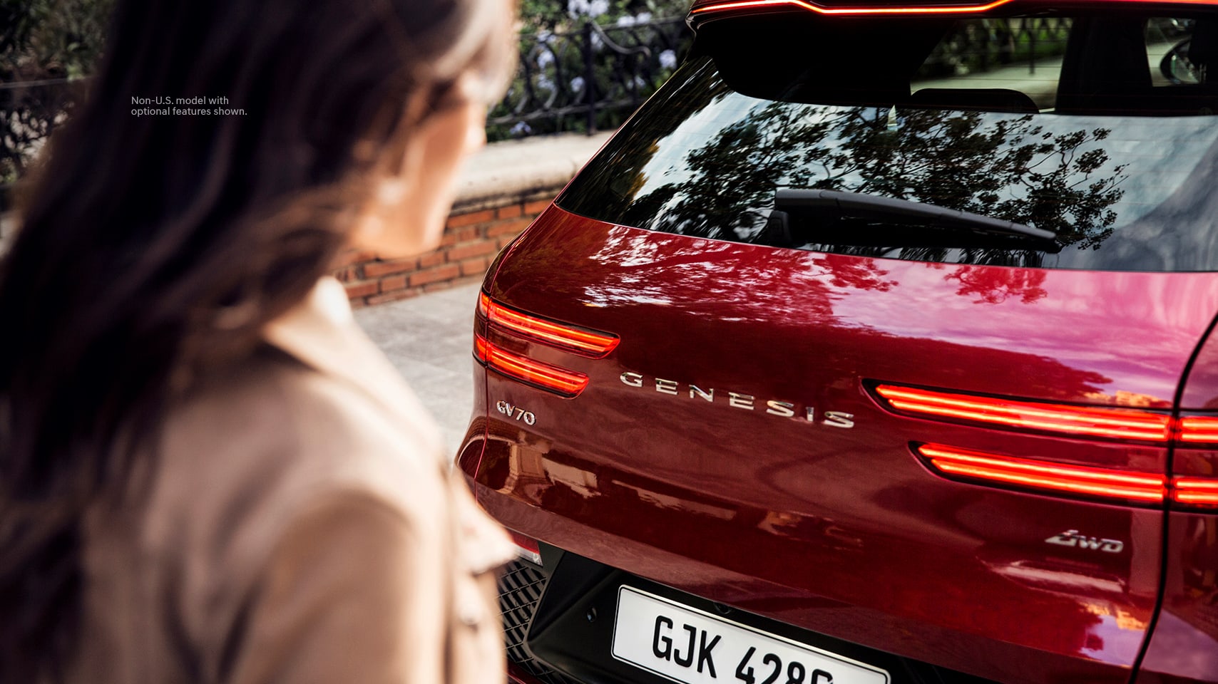 2023 Genesis GV70 shown in Mauna Red.