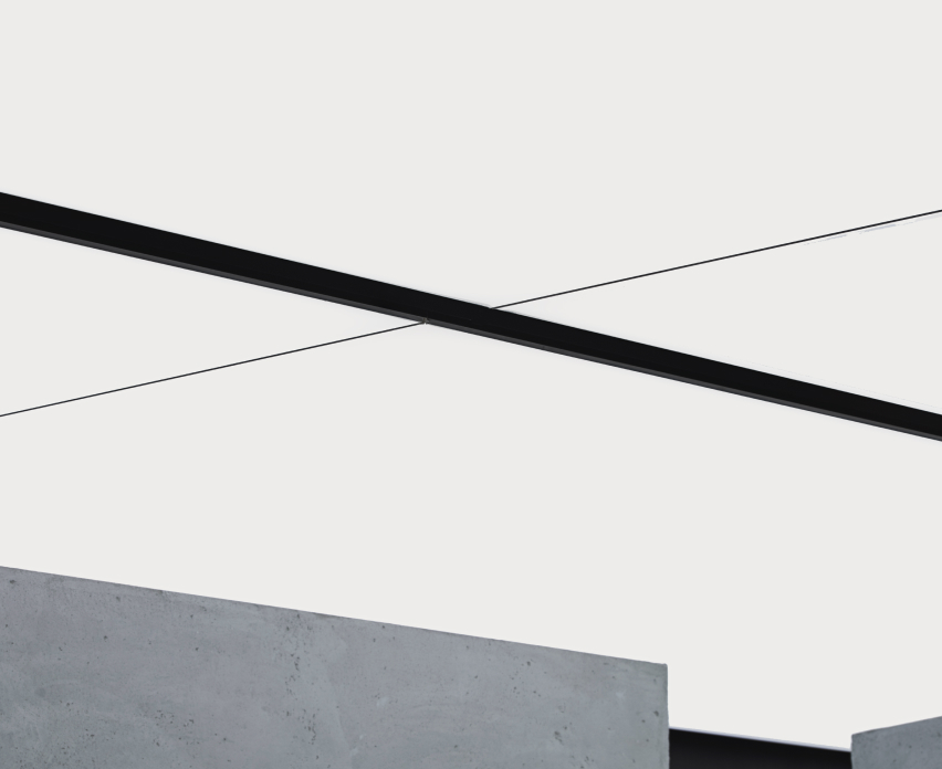 Ceiling light panels emit a soft, white light.