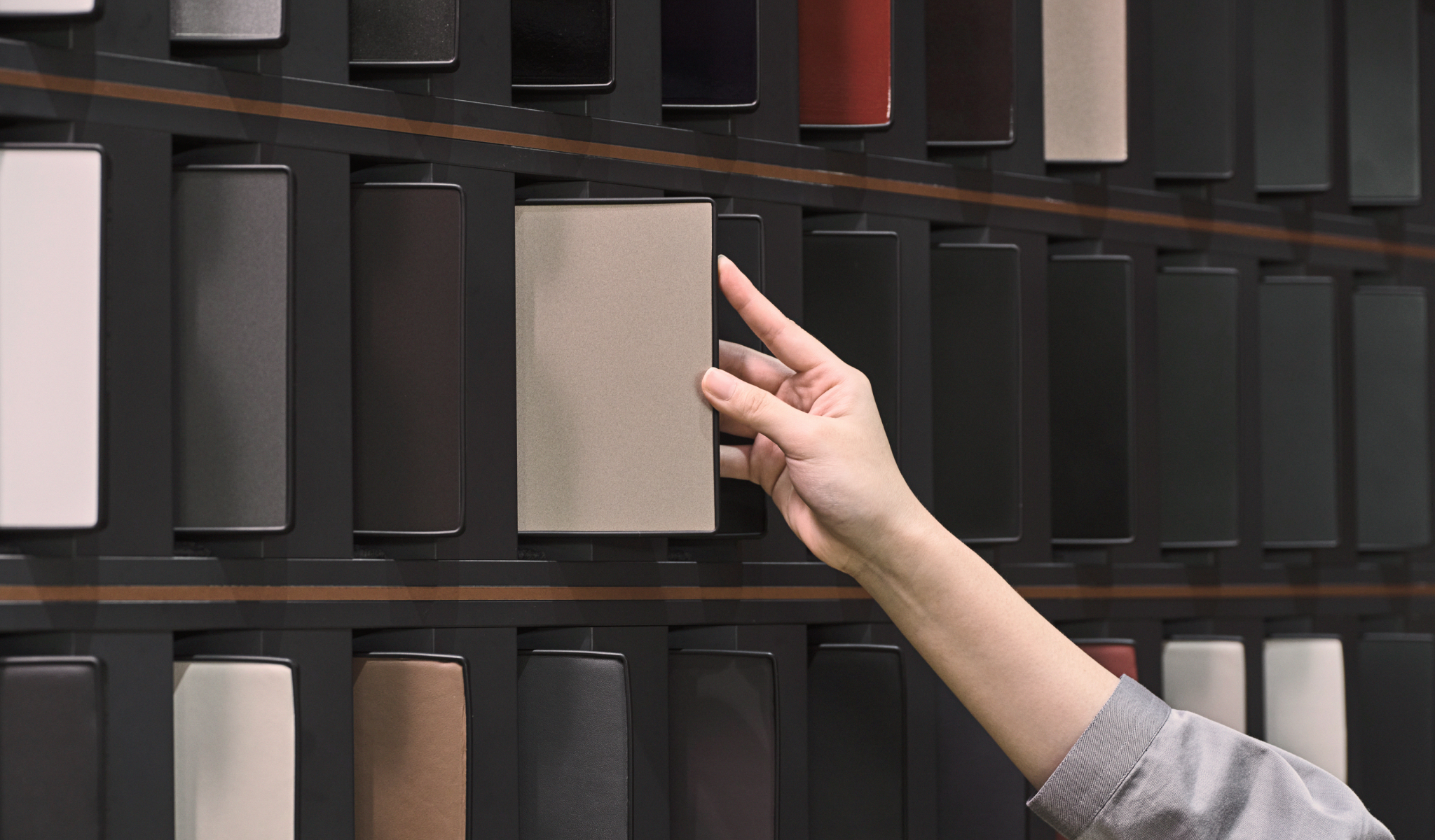 A curator presents a variety of interior and exterior samples in the Design Dialogue room.