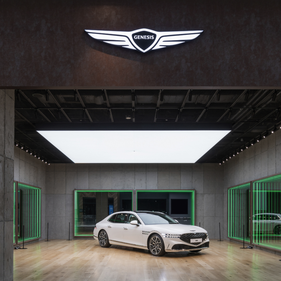 Genesis Studio Hanam is seen with a Genesis vehicle on display surrounded by lighting and the Infinity Mirror.